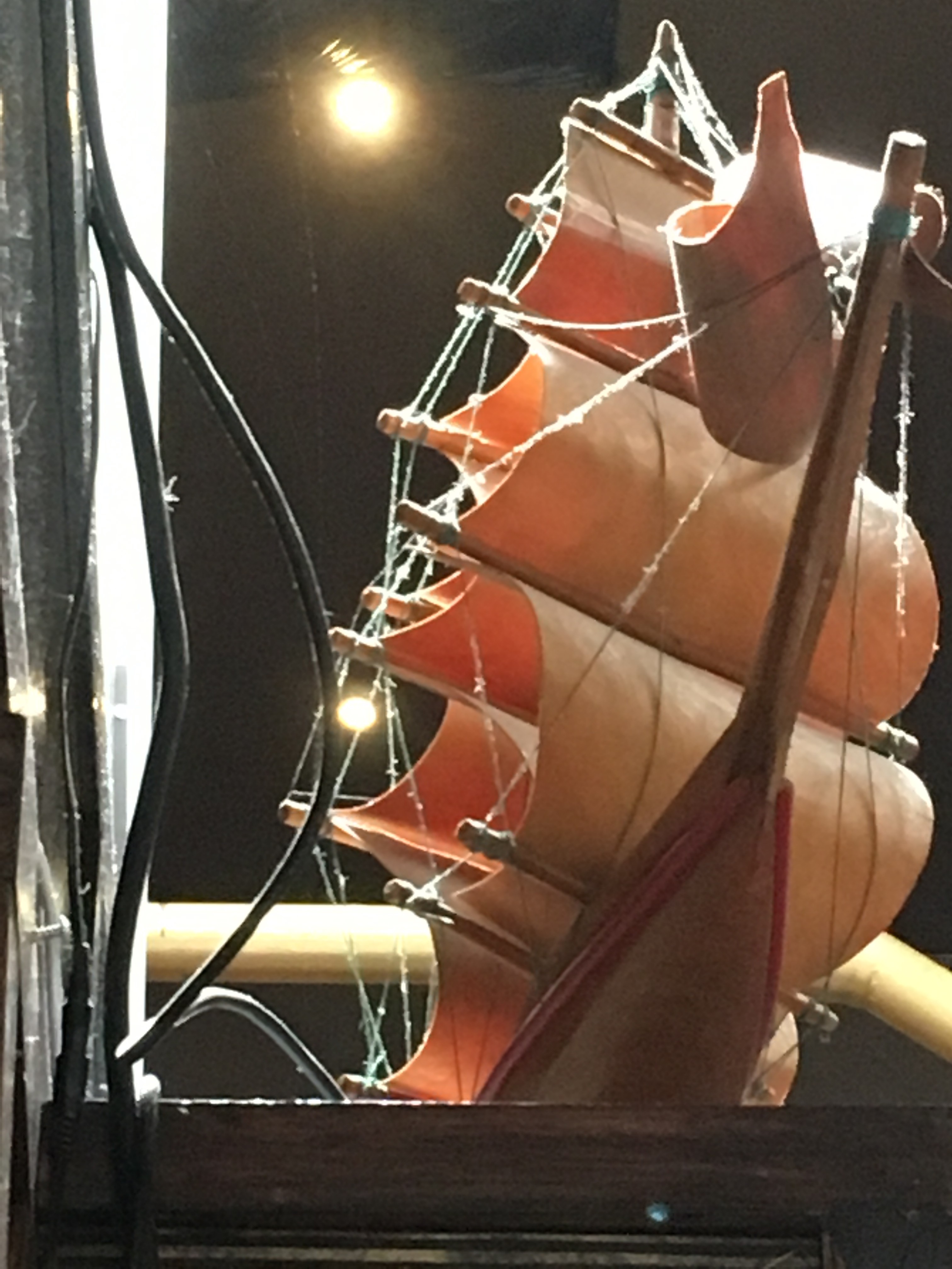 A model tall ship covered in dust