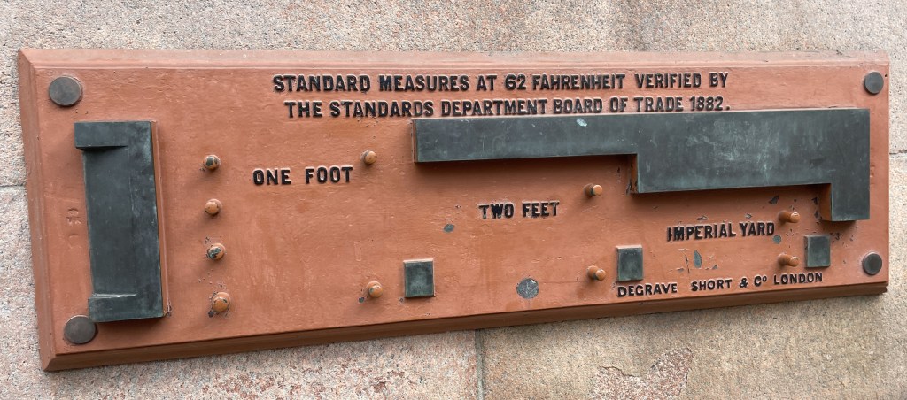 The standard measures at 62 Fahrenheit verified by the Standards Department Board of Trade 1882 of 1 foot, 2 feet and and Imperial Yard. As mounted on at wall in Glasgow, UK. 
